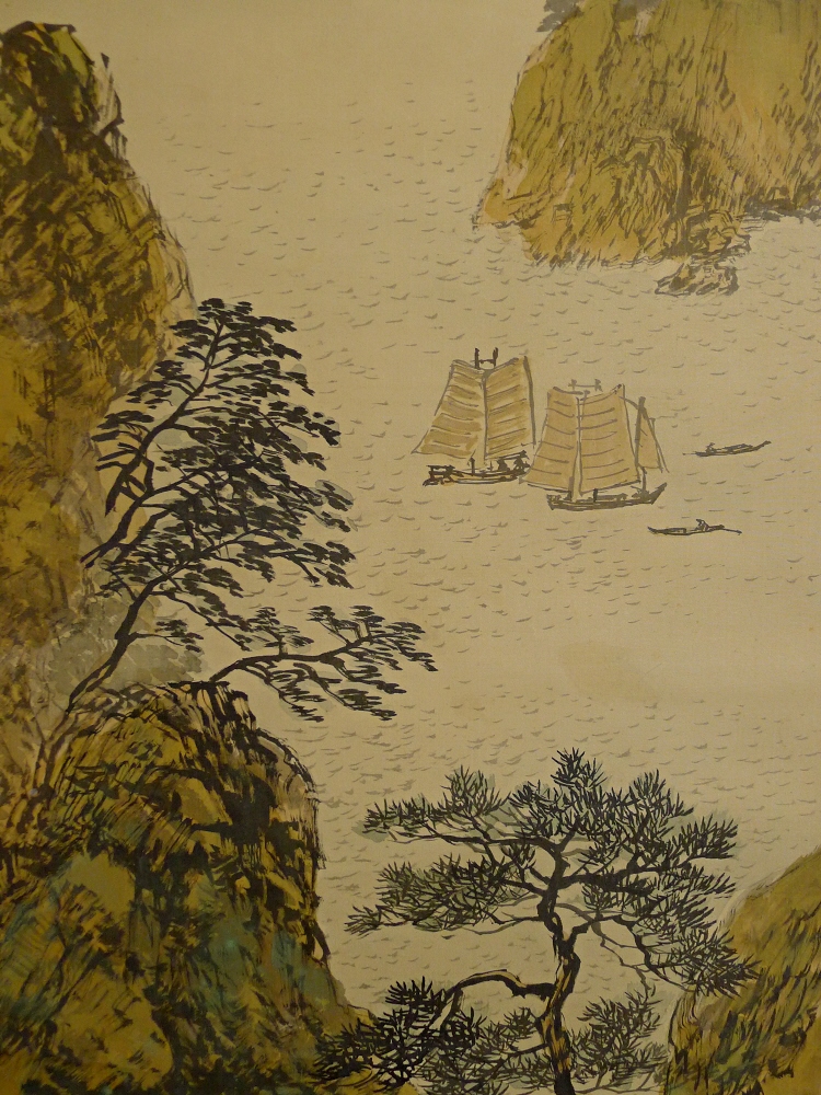 Sail Boats heading offshore among the sea cliffs