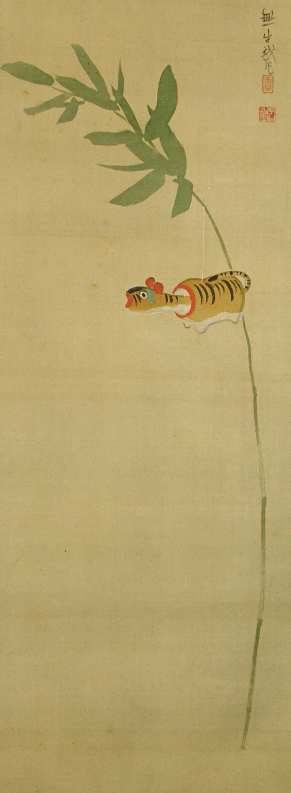 Papier-mache Tiger hung on Bamboo Branch